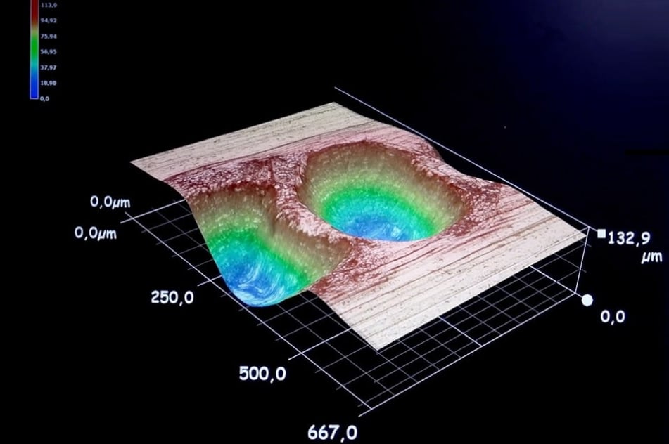 Microscope analysis of a dot peen impact by Technomark